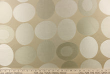 Load image into Gallery viewer,  Stylish, modern and contemporary best describe this geometric pattern of circles and ovals in light gold or cream colors on a khaki background.
