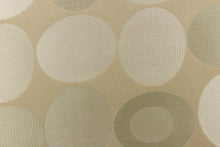 Load image into Gallery viewer,  Stylish, modern and contemporary best describe this geometric pattern of circles and ovals in light gold or cream colors on a khaki background.

