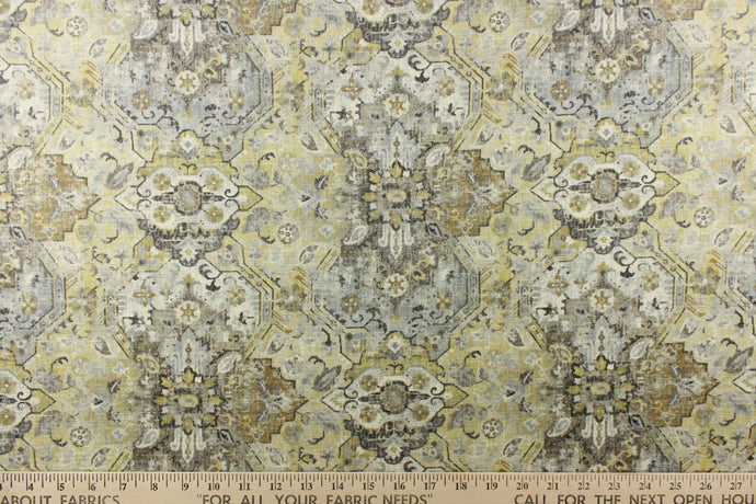 This medium weight fabric features a unique abstract design in muted golds, gray, yellow, off white and charcoal.