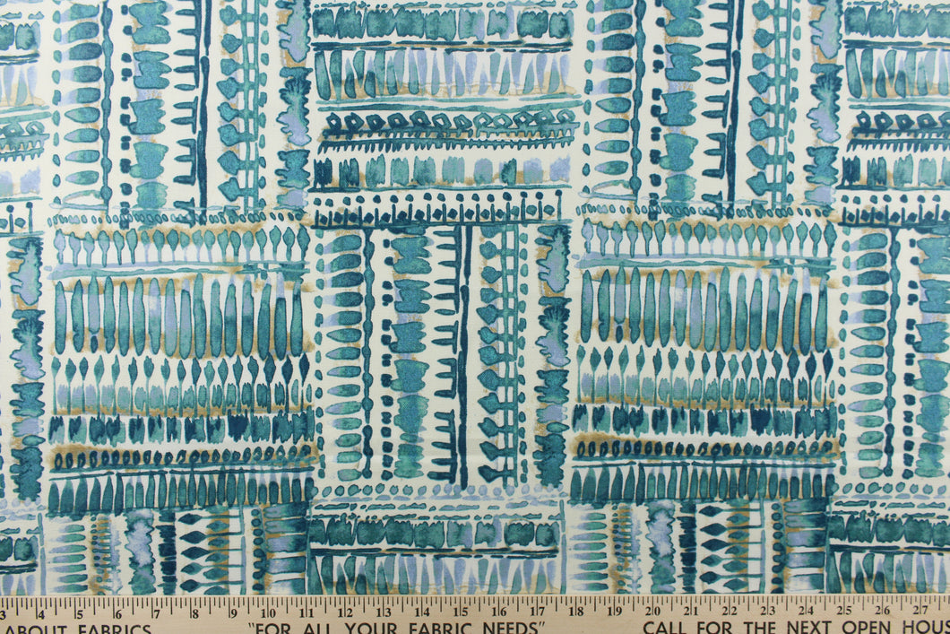 : This fabric has a geometric look with squares full of  rows of what looks like paint blots, in different tones of turquoise with hints of water blue and khaki set against a dull white. 