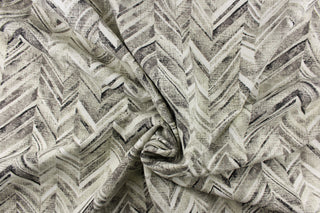 This fabric features a chevron design in shades of black, gray and white
