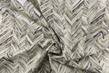 Load image into Gallery viewer, This fabric features a chevron design in shades of black, gray and white
