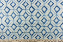 Load image into Gallery viewer,  This fabric features a geometric design of diamonds in shades of blue with white.
