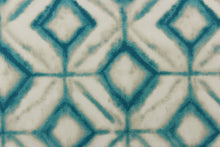 Load image into Gallery viewer, This fabric features a geometric design of diamonds in turquoise with white and hints of gray.
