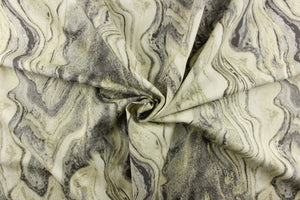  This fabric features a marble design in gray tones, and off white with hints of a green tone. 