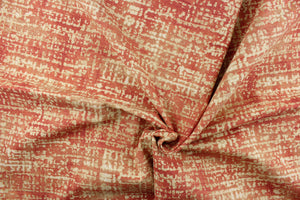 This fabric features an abstract design brick red with off white and light beige tones.