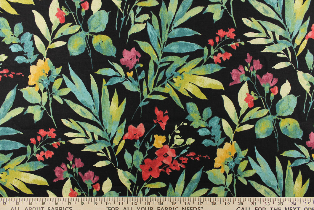 This vibrant fabric features a floral design in greens, teals, reds, yellows, pinks, and purple against a black background.