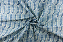Load image into Gallery viewer,  This fabric features a geometric design in shades of blue and white. 
