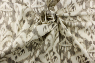  This fabric features a demask like design in gray and off white. 