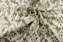 Load image into Gallery viewer,  This fabric features a demask like design in gray and off white. 
