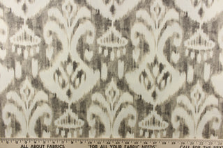  This fabric features a demask like design in gray and off white. 