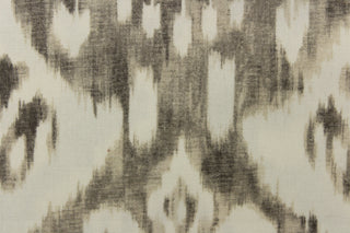  This fabric features a demask like design in gray and off white. 