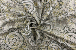 This fabric features a beautiful paisley design in colors gray, mute gold, dark green, and white with hints of off white.