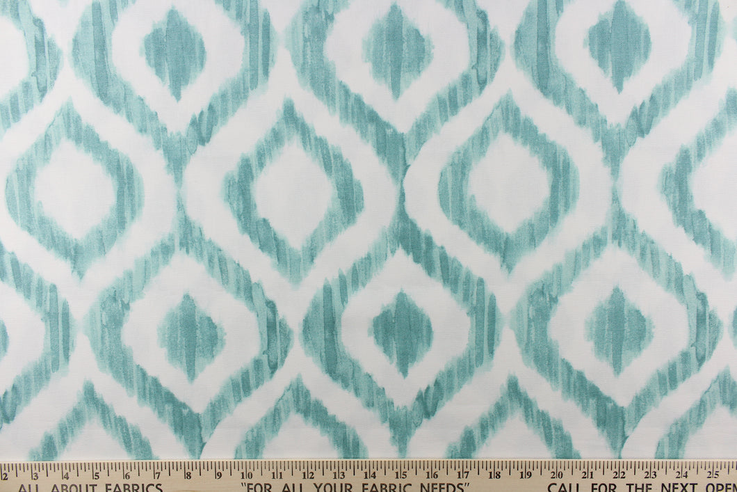  This geometric design features a diamond pattern in shades of ocean blue and white.