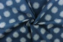 Load image into Gallery viewer, This fabric features a geometric design of circles in white on a blue background. 
