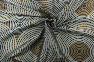  Stylish, modern and contemporary best describe this geometric multi-layer, circular pattern in tone on tone colors in black, blue gray and dark gold tones. 