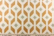 Load image into Gallery viewer,  Offering a geometric large ikat diamond design on a cream or natural background with a gorgeous cognac brown with a smaller gray diamond in the center. 
