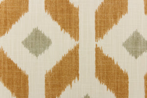  Offering a geometric large ikat diamond design on a cream or natural background with a gorgeous cognac brown with a smaller gray diamond in the center. 