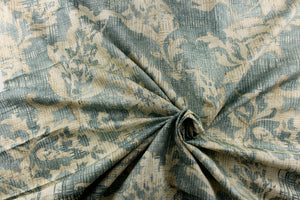  A unique pattern featuring a floral design that is visible from a distance and blurs or blends as you get closer in a light blue spa color with hints of a slightly darker gray blue and also contains the cream and khaki colors.