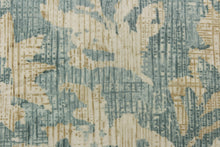 Load image into Gallery viewer,  A unique pattern featuring a floral design that is visible from a distance and blurs or blends as you get closer in a light blue spa color with hints of a slightly darker gray blue and also contains the cream and khaki colors.
