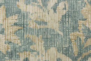  A unique pattern featuring a floral design that is visible from a distance and blurs or blends as you get closer in a light blue spa color with hints of a slightly darker gray blue and also contains the cream and khaki colors.