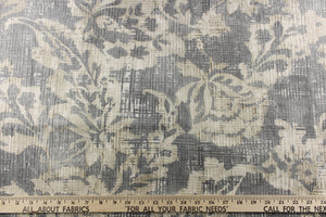  A unique pattern featuring a floral design that is visible from a distance and blurs or blends as you get closer in cream, light and dark gray with some hits of dark brown or beige. I