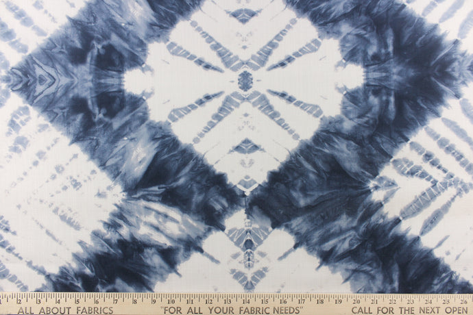  In a geometric batik diamond design and tie dye appearance in a beautiful indigo blue with white colors.