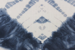 In a geometric batik diamond design and tie dye appearance in a beautiful indigo blue with white colors.