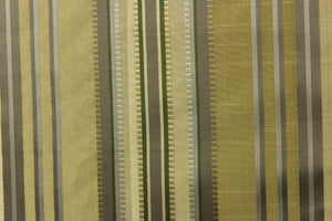 This stunning yarn dyed fabric features a multi width striped pattern in colors of dark green, silver, and khaki or beige.