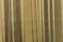 Load image into Gallery viewer,  This stunning yarn dyed fabric features a multi width striped pattern in colors of green, rust, gold and pewter 

