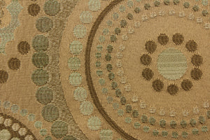 This contemporary geometric design features overlapping circles and dots in beige, green tones, gold and champagne colors. 