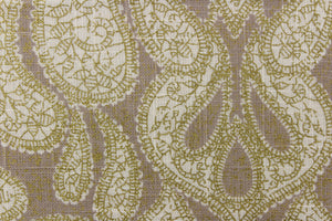 This fabric features a beautiful demask design in cream and gold against a light beige background. 