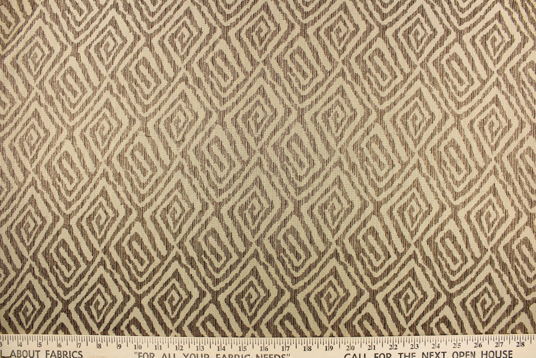 This fabric features a geometric print in the colors of brown and tan.  It has a soft drapable hand and would be ideal for swags, window scarves and drapery panels.