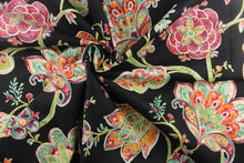 Load image into Gallery viewer,  A dramatic fabric with bold colors featuring a large floral print has a black background with teal green, orange, purple, hints of beige and white, and dark pink or burgundy colors.
