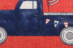 This indoor/outdoor fabric panel features a old blue pickup up truck with an American flag in its typical colors of red, white and blue on a solid red background.  Uses include patios, pillows and totes.  Approximate 6 prints per yard. 