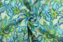 Load image into Gallery viewer, This Solarium outdoor decorative print features a large floral design in shades of blue, shades of green, white and yellow against an ivory background.  This versatile, long-lasting fabric can withstand up to 500 hours of sunlight, water and stain resistant and has 10,000 double rubs.  It is perfect for lounge cushions, pool furniture, tablecloths, decorative pillows and upholstery projects.  This fabric has a slightly stiff feel but is easy to work with.  
