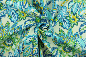 This Solarium outdoor decorative print features a large floral design in shades of blue, shades of green, white and yellow against an ivory background.  This versatile, long-lasting fabric can withstand up to 500 hours of sunlight, water and stain resistant and has 10,000 double rubs.  It is perfect for lounge cushions, pool furniture, tablecloths, decorative pillows and upholstery projects.  This fabric has a slightly stiff feel but is easy to work with.  
