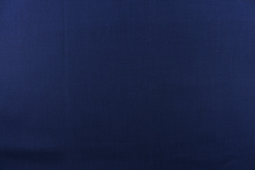 This fabric in a solid navy blue with a slight horizontal pinstripe, is great for umbrellas, outdoor upholstery and more. 