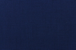 This fabric in a solid navy blue with a slight horizontal pinstripe, is great for umbrellas, outdoor upholstery and more. 