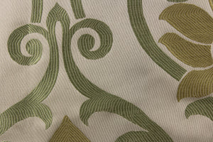 This elegant jacquard fabric features a woven ornamental damask design with hints of green and gold on a taupe background