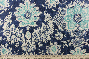 A beautiful medallion design in blue, turquoise, navy, and cream .