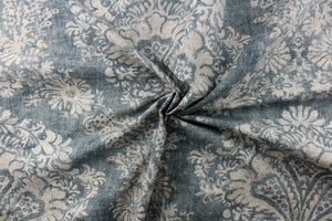  A large demask design in gray, and blue colors .
