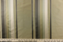 Load image into Gallery viewer, Rich and formal describe this medium weight yarn dye fabric which features a multi width striped pattern in colors of gold, gray and khaki or beige .
