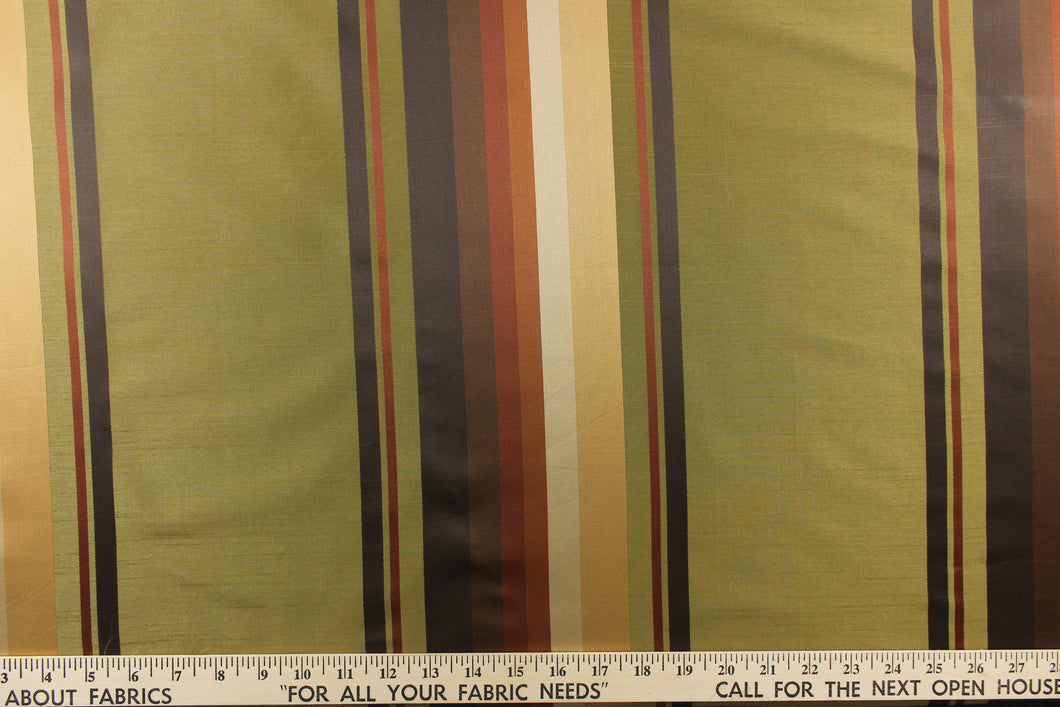 Rich and formal describe this medium weight yarn dye fabric which  features a multi width striped pattern in colors of gold, burnt orange, brick red, brown, and green.