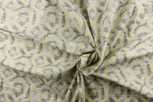 Load image into Gallery viewer, This beautiful fabric features a geometric design in gray and a pale yellowish green color with hints of white.

