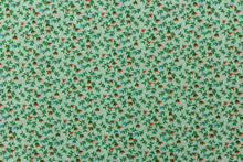 Load image into Gallery viewer,  This fabric features a dainty floral design in pale green  with orange, blue and white flowers .

