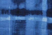 Load image into Gallery viewer, Arno is a plaid linen blend fabric in indigo.  The versatile fabric is perfect for window accents (draperies, valances, curtains and swags) cornice boards, accent pillows, bedding, headboards, cushions, ottomans, slipcovers and upholstery.  It has a soft workable feel yet is stable and durable with 24,000 double rubs.
