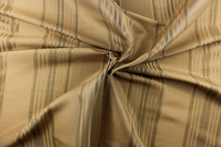 : This fabric features a striped design in gold on a gold  background. 