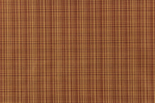 Load image into Gallery viewer, This stunning yarn dyed fabric features a small plaid design in a deep red and golden tan. 
