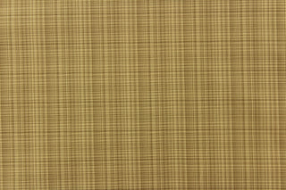 This stunning yarn dyed fabric features a small plaid design in beige and brown tones .